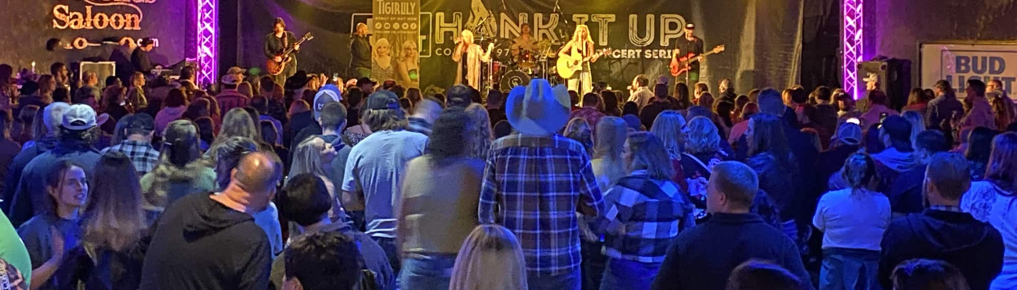 country concert with fans wearing cowboy hats Lafayette